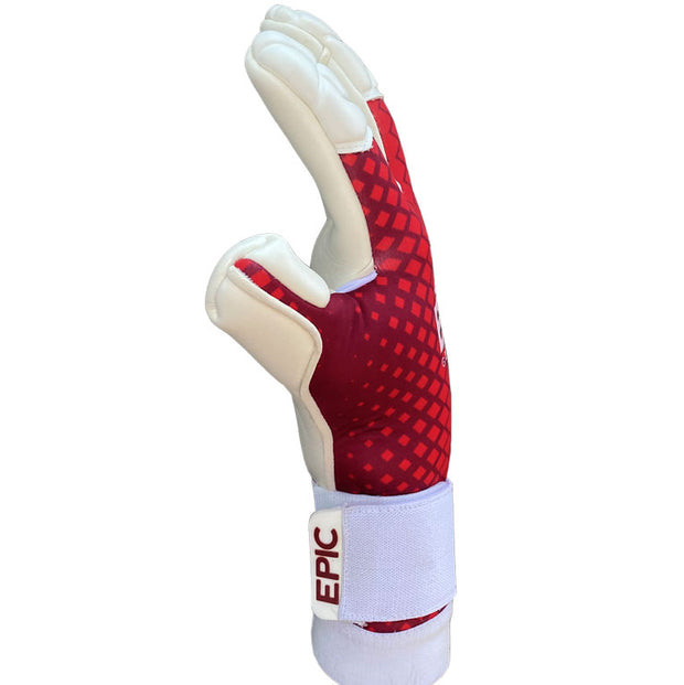 Red and white soccer goalkeeper glove with the word "EPIC" printed on the strap. This soccer goalie glove has a white strap and white finger tips. The name of this soccer glove is the "Touch" by EPIC Soccer Academy.